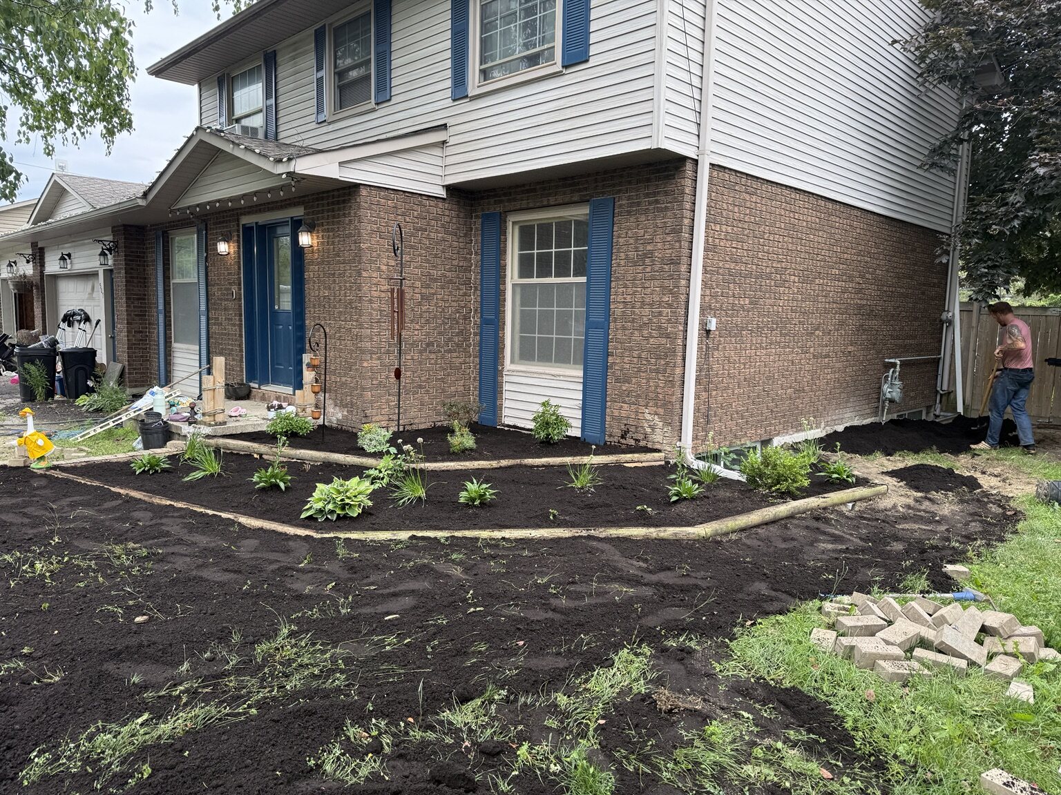 Large garden bed redesign wrapping around a home