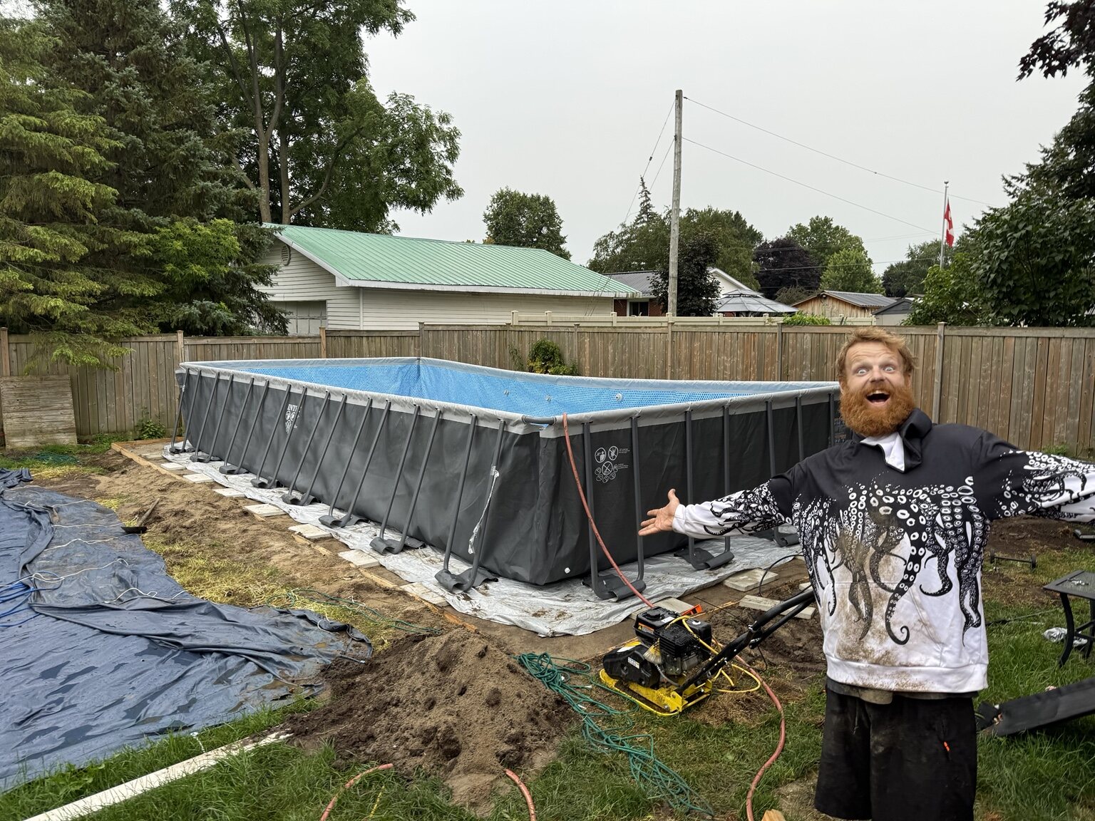 Phil beside a prepared above-ground pool site